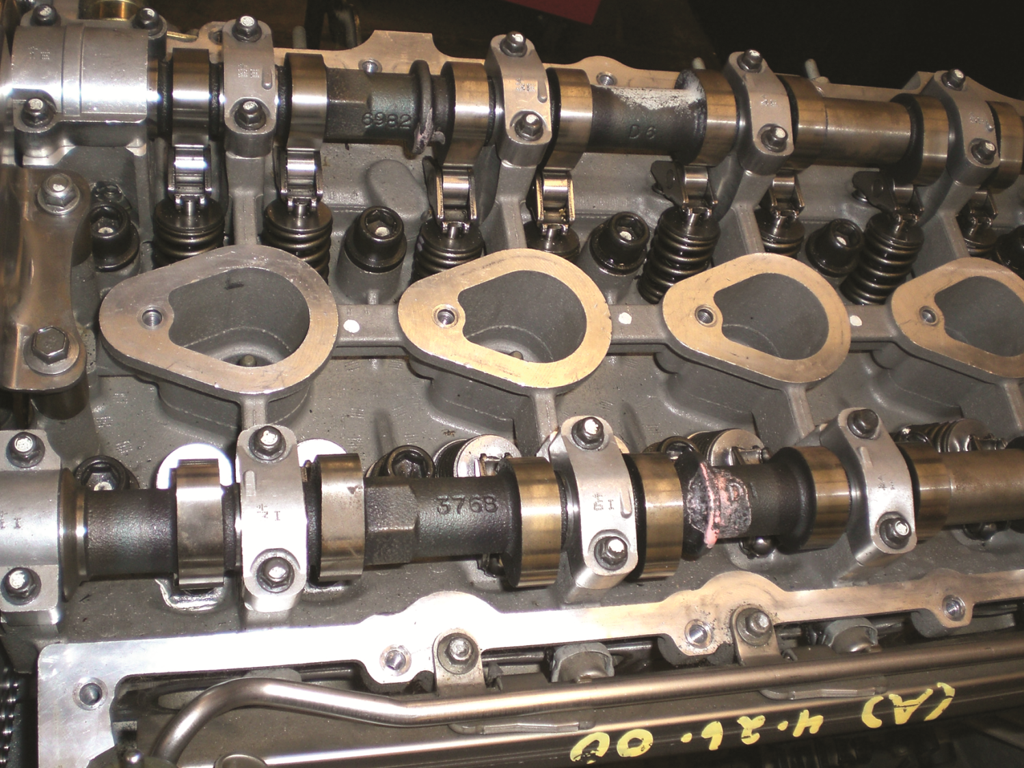 A DOHC engine uses a camshaft for the intake valve and a separate camshaft for the exhaust valves in ...