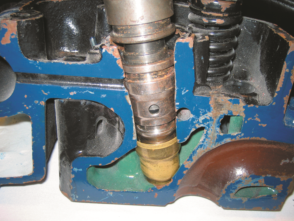 A HEUI injector from a Ford  PowerStroke diesel engine. The grooves indicate the location of the ...