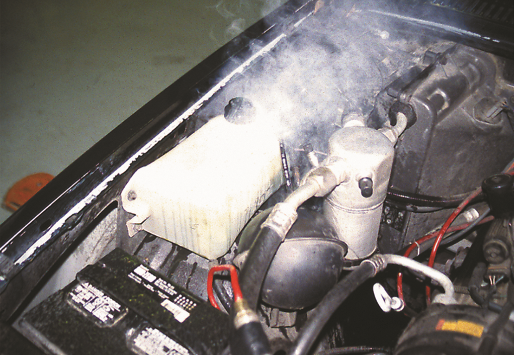 When an engine overheats, often the coolant overflow container boils.