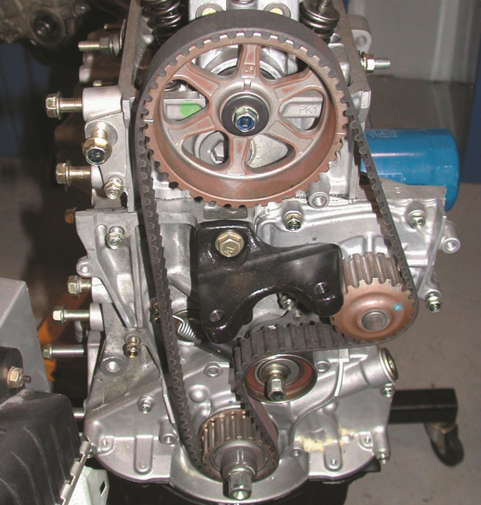 A single overhead camshaft engine with  a timing belt that also rotates the water pump.