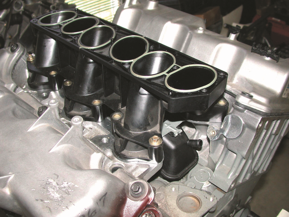 The lower intake manifold attaches  to the cylinder heads.