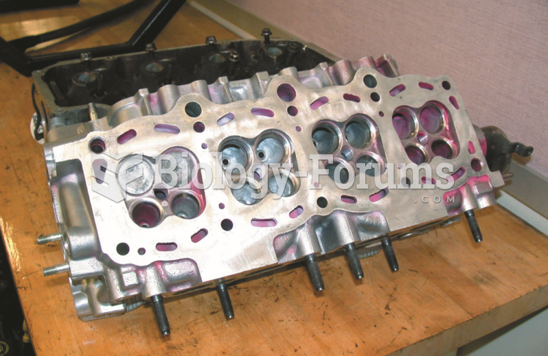 A cylinder head with four valves per cylinder, two intake valves (larger) and two exhaust valves ...