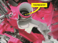 A cutaway of a small block Chevrolet  V-8 showing the passage from the cylinder head  through the ...