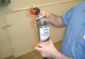 Remove the fuel injector cleaning canister’s top and regulator assembly. Note that there is an ...