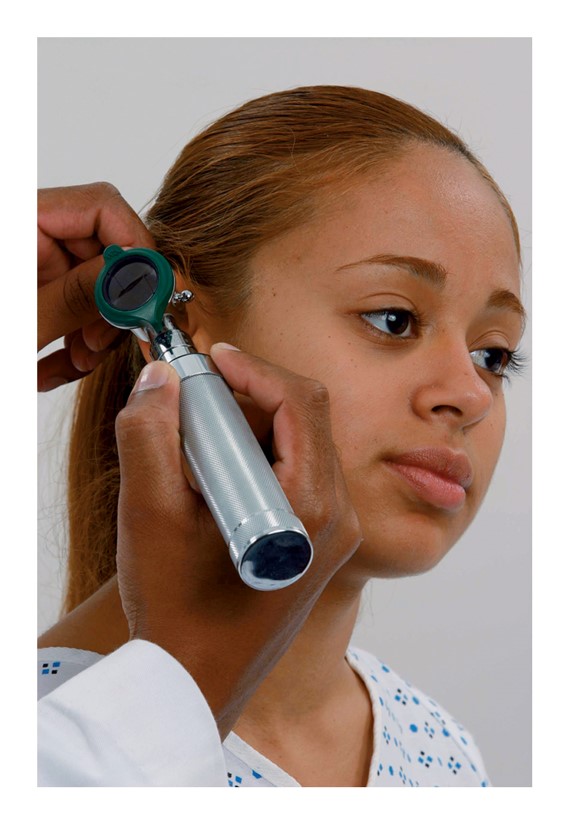 Two techniques for holding and inserting an otoscope