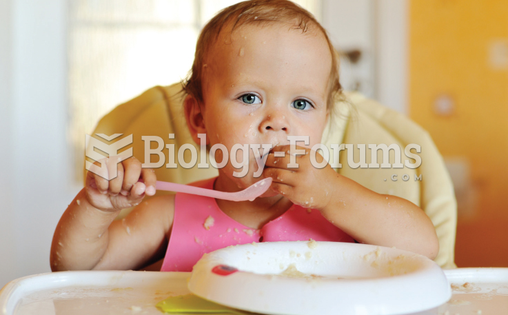 6 month old baby in highchair eating