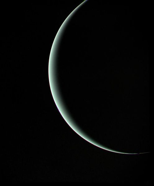 Crescent Uranus as imaged by Voyager 2 while departing for Neptune