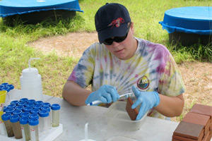 USF Biologist Taegan McMahon conducts experiments on chlorothalonil at a research facility in East H