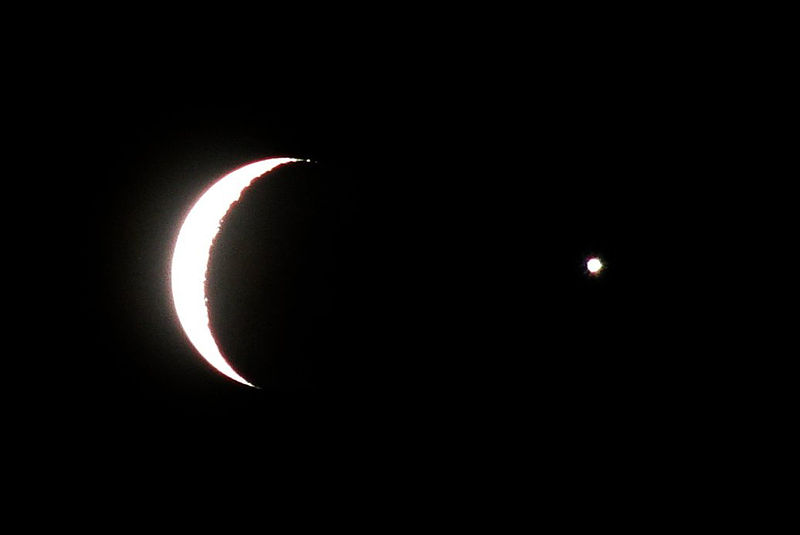 A crescent Moon and "star"