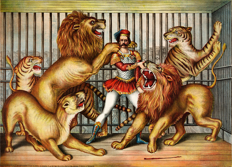 Nineteenth century etching of a lion tamer in a cage of lions