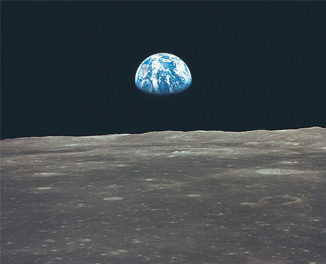 Oasis in space: earthrise over the moon's horizon.