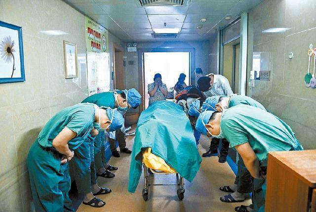 Doctors in China pray before operating