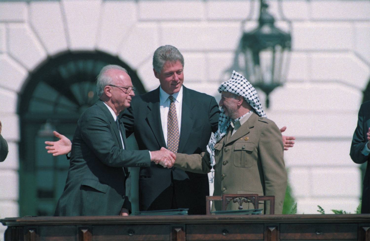 In 1993 Clinton succeeded in brokering a deal between Israeli prime minister Yitzhak Rabin (left) ...