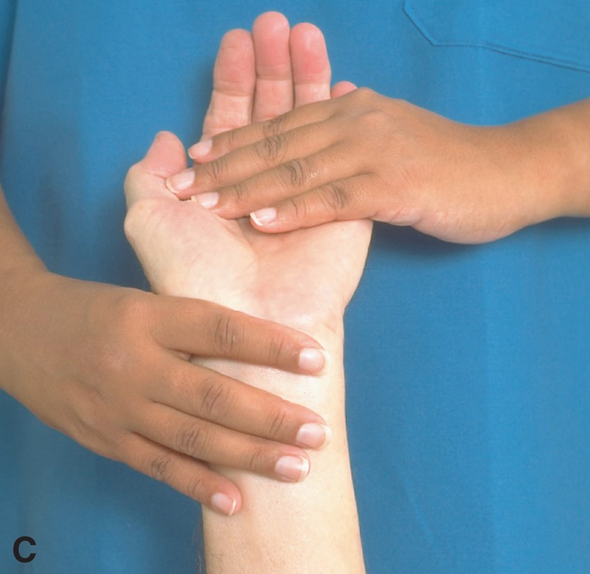 ROM exercises on a patient’s wrist: extension.