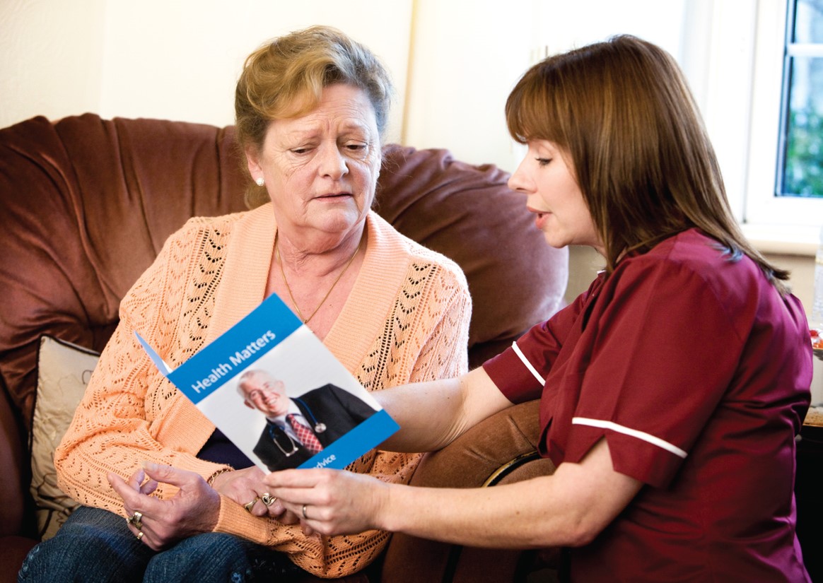 Using educational materials, the medical assistant discusses lifestyle changes with a diabetic ...