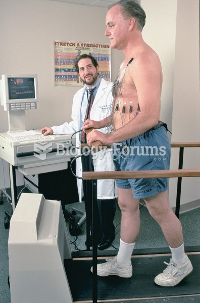 Man undergoing a stress test on a treadmill while physician monitors his condition