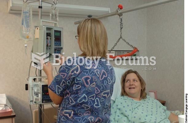 A nurse adjusts the rate of a client’s IV.