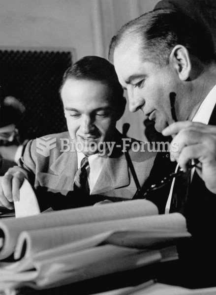 Senator Joe McCarthy and his aide Roy Cohn (left) listen to testimony at the Army-McCarthy hearings ...