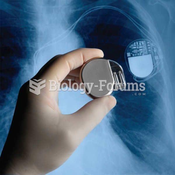 A surgeon holds a pacemaker next to an X-ray of a pacemaker implanted in a patient’s chest. 