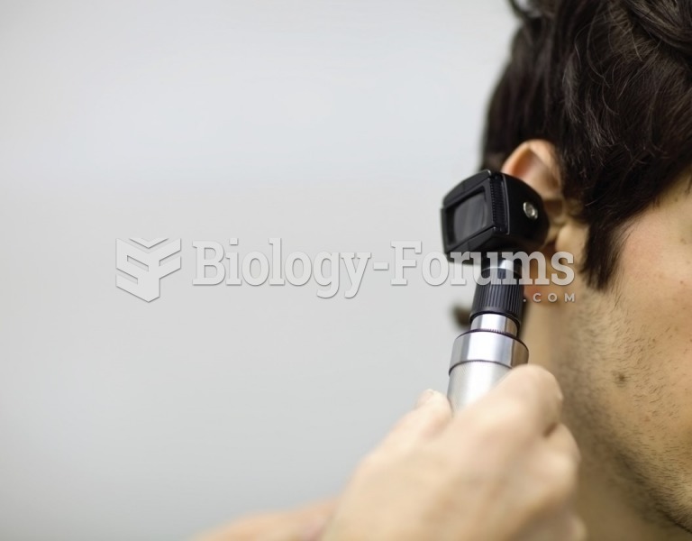 Inspecting a patient’s ear during a physical examination. 