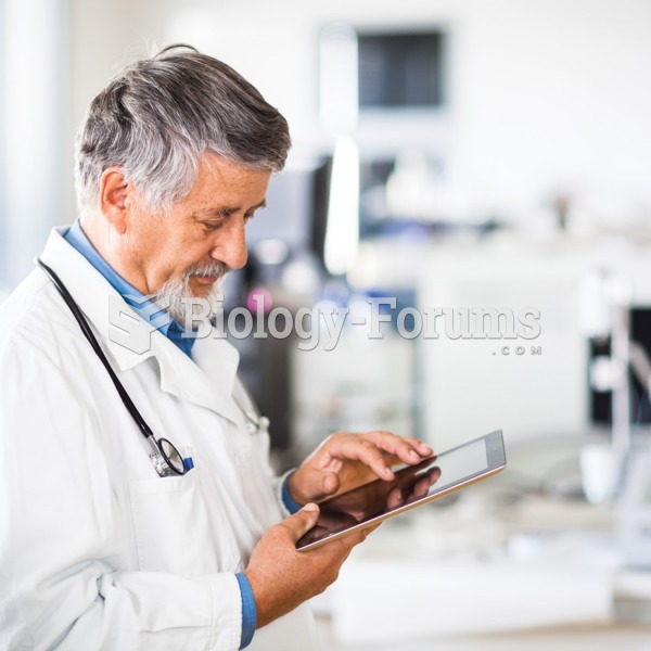 A physician uses a portable electronic tablet to enter patient data while in the examination room. 