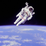 Because of the hazards of a vacuum, astronauts must wear a pressurized space suit while outside thei