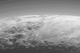Close-up view of Pluto's mountains, frozen plains and hazes